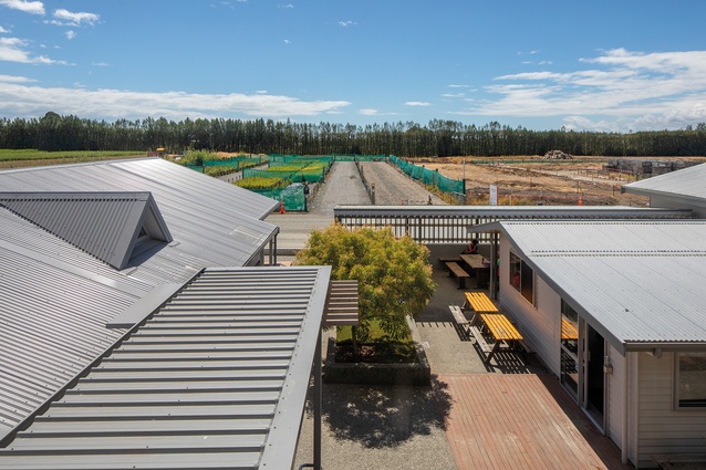 Fields and work areas run right up to the edges of the compound.