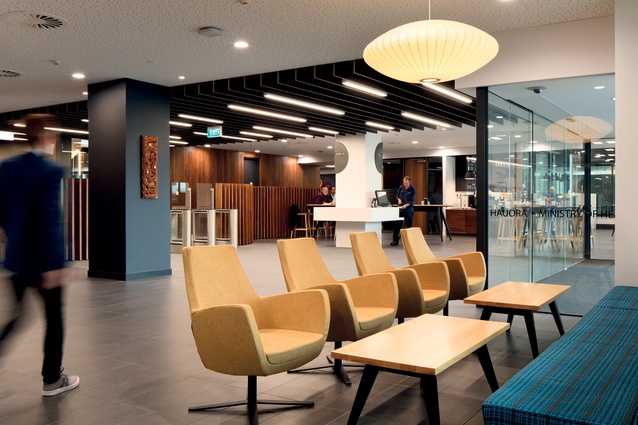 The open-plan foyer, reception and café has a warm and inviting palette of materials.