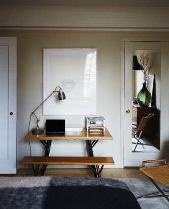 A desk space is tucked into the bedroom.