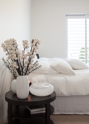Loutit's pared back aesthetic flows through to the master bedroom.