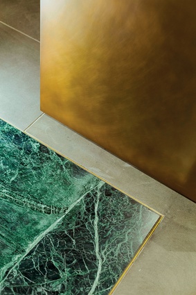 Some of the materials used in the Experience Centre Sydney include: Empress Green marble stone slab (honed finish with brass edge), basalt natural stone tile and Atlantic Stone granite slab.
