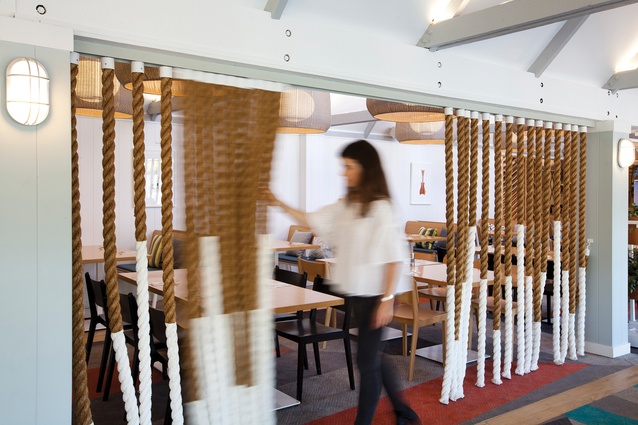 On one side of the restaurant, ropes dipped in white paint create movable screens between public spaces; the ropes can be merged or separated for different events.