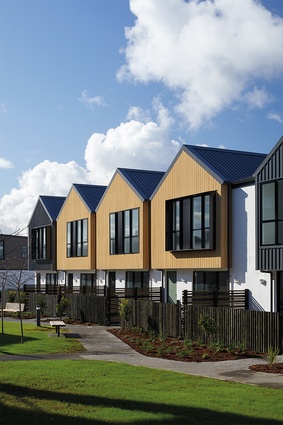 A row of five four-bedroomed terraced houses overlooks the linear pocket park.