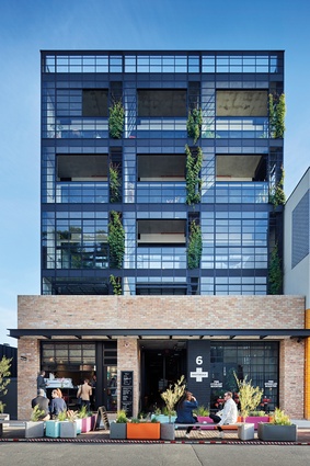 The exterior building envelope is made of recycled brick, steel-and-glass warehouse windows and Australian bluestone cobbles.