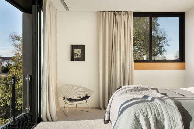 The bedroom within the cantilevered gold box boasts significant natural light and views.