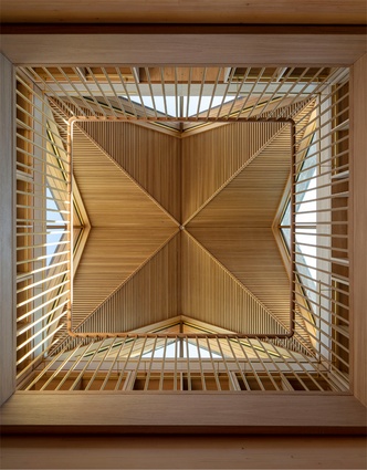 The New Library, Magdalene College in Cambridge by Níall McLaughlin Architects. The ceiling floods light into the space drawing people in and creating a calming effect through the movement of light.