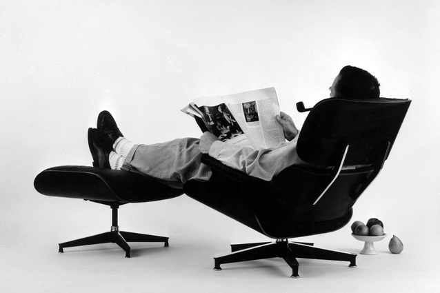 Charles Eames in the plywood Lounge and Ottoman. Photograph for an advertisement in 1956. 