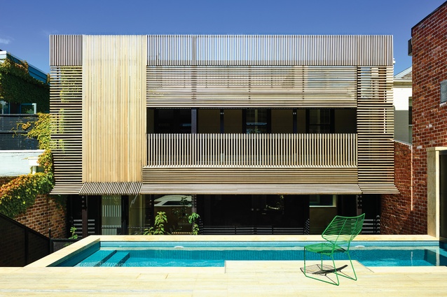 A battened timber screen creates a striking facade while also providing shade and privacy.