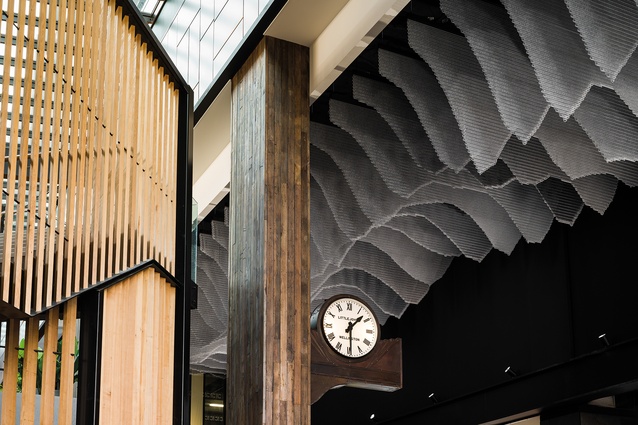 Hung mesh-shaped sections inspired by the Southern Alps line the ceiling of the Market Lane atrium.