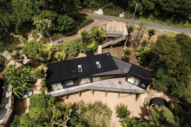An aerial view of the home shows the two living spaces connected by the roof.