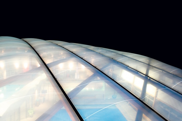A triple-layer ETFE dome crowns the pool complex.