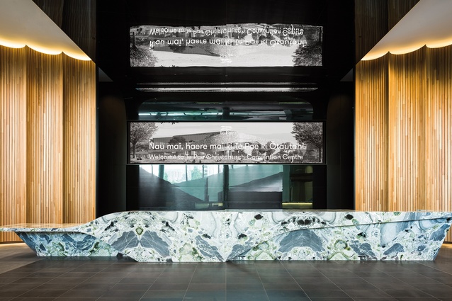 A sculptural, polychromatic Italian marble desk is the principal feature of the reception area.