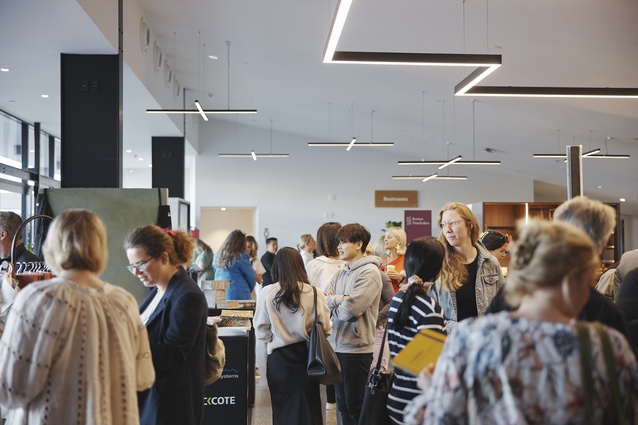 Conference attendees visit designers in the Exhibition Space, including Lyzadie Design Studio, Rockcote, Billi, Eva, Critical and Arlington.