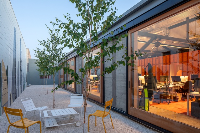 Outdoor social space, where doors open to let nature flow through the work spaces. 