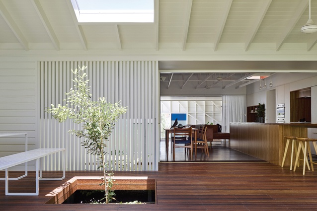 Transitional zones on either side of the main living area provide cross-ventilation and shade.
