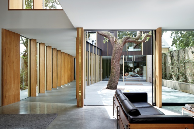 The view from the sitting room into the courtyard and walkway reveals the spacious, well-conceived nature of the plan.