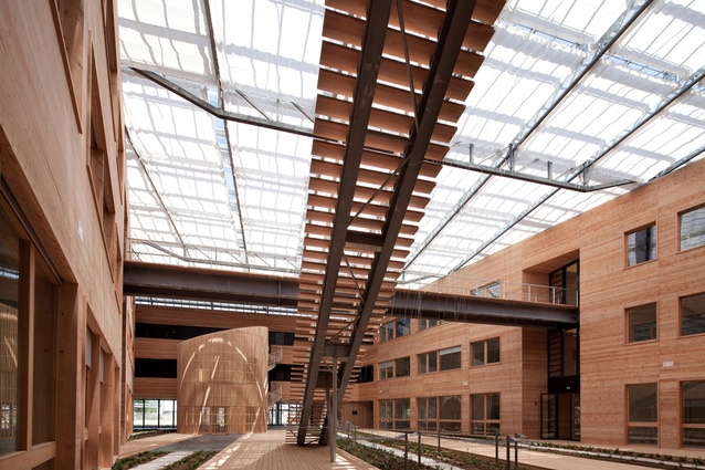 French National Solar Energy Institute. The glass roof is designed on a north-south axis to maximise the use of the sun and regulate the temperature inside the atrium.