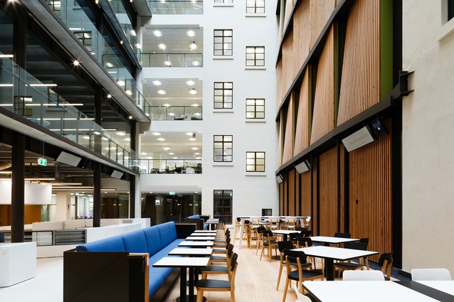 MBIE in Wellington by Warren and Mahoney. The atrium is a highly active area for interactions and meetings in an informal yet dramatic setting.