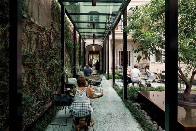 This landscaped area of Casa Cavia is used as an alfresco dining space but also has a cocktail bar in green marble. 
