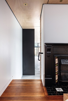 A change in material signals the line between the heritage cottage and the new living spaces.