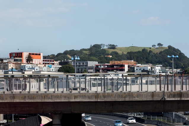 The Orange building sits within the fringe city of Newton, with Maungawhau, or Mount Eden, nearby. 
