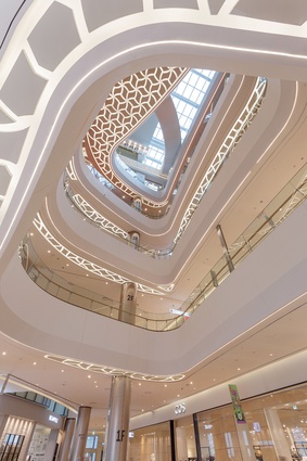 Lotte World Mall in South Korea by Benoy incorporates sculptural ceilings to enhance social interaction in its central atrium. 
