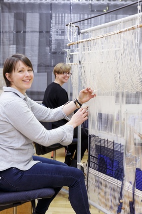 Justin Hill’s <i>22 Temenggong Road, Twilight</i>, being woven by ATW’s intern weavers.