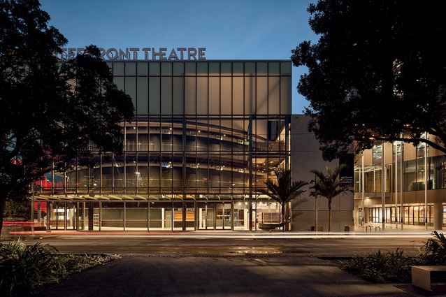 The frontage of the new ASB Waterfront Theatre in Wynyard Quarter sports opal glass and a curved container behind the glazing, giving the impression of a cylinder coiled in a tube. 