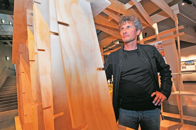 Chris Moller in front of an installation for <em>Kiwi Prefab</em> at Puke Ariki, New Plymouth in 2013. 