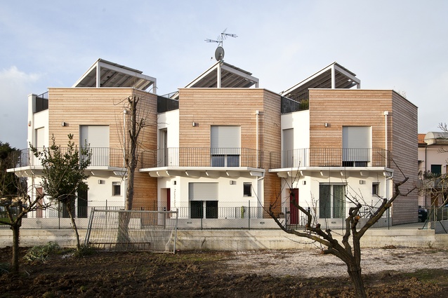Straw bale townhouses in Fano, Italy by Archética, 2015. 