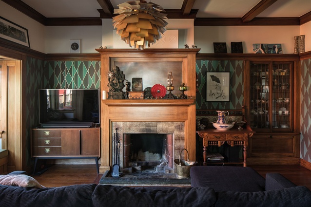 The TV cabinet is from Mr. Bigglesworthy, which fits well with the patterned wallpaper and preserved fireplace.