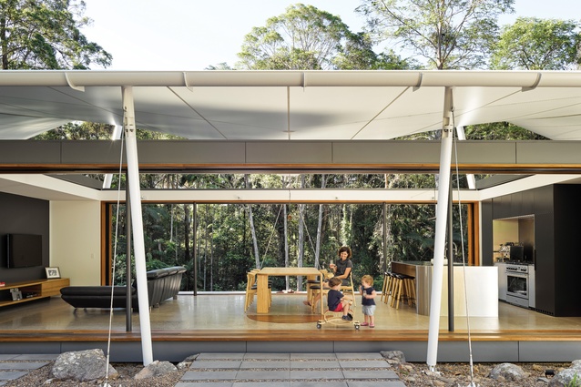 For most of the year, responding to the climate on the Sunshine Coast, the house operates as an open platform sheltered by a fabric roof.