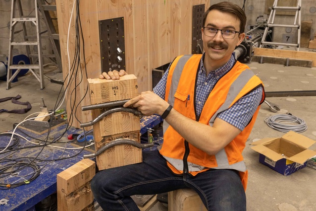 Ben Moerman shows how the steel dowels in the specially designed connections bend to absorb seismic energy and prevent the walls from being significantly damaged or collapsing.
