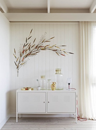 A cabinet from Ikea and a wall sculpture by Curtis Jere. 