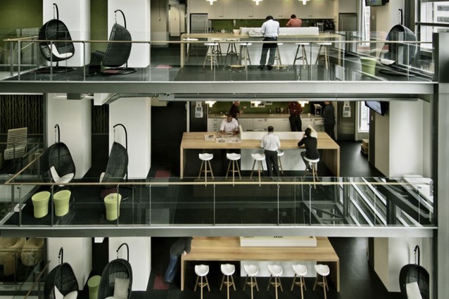 Warren and Mahoney's Spark Central, Wellington. Hot desks and cafes are located next to the atrium to create fluidity, animate the space and foster social interaction.