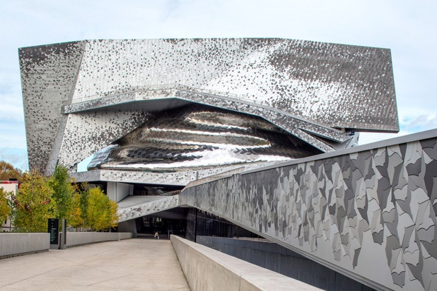 Philharmonie de Paris, France, designed (and subsequently disowned) by Jean Nouvel. The angular exterior features multi-hued interlocking bird-shaped tiles that seem to shimmer and move.