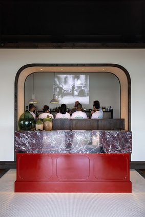 Bivacco’s bespoke maitre-d station with its opulent, red-veined marble counter top.