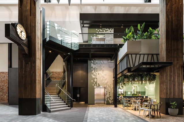 The Market Lane atrium features a mezzanine walkway and the refurbished historic clock from the once NZIC building.