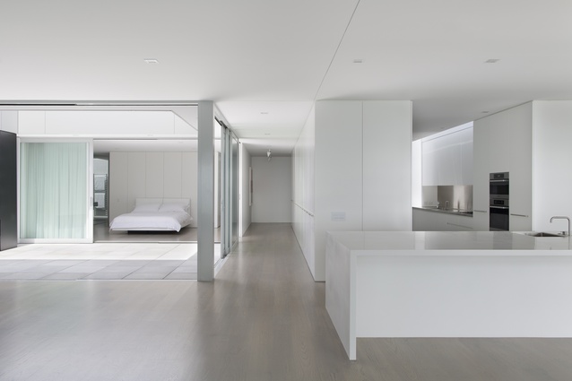 The open part of the kitchen is dominated by a white Corian island.