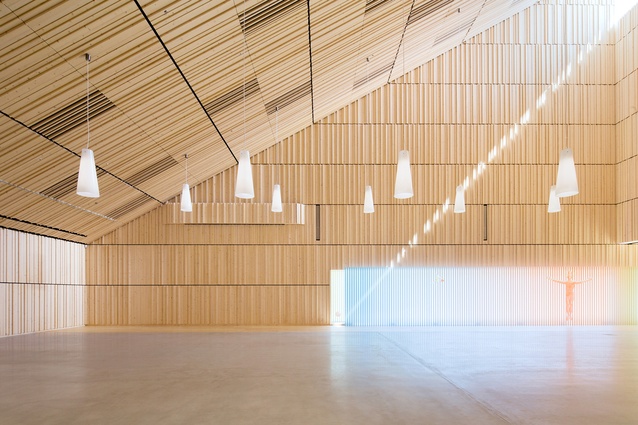 Suvela Chapel, Finland. A hybrid structure with wooden as well as concrete and steel elements. The interior is made of local spruce that creates a warm, welcoming atmosphere.