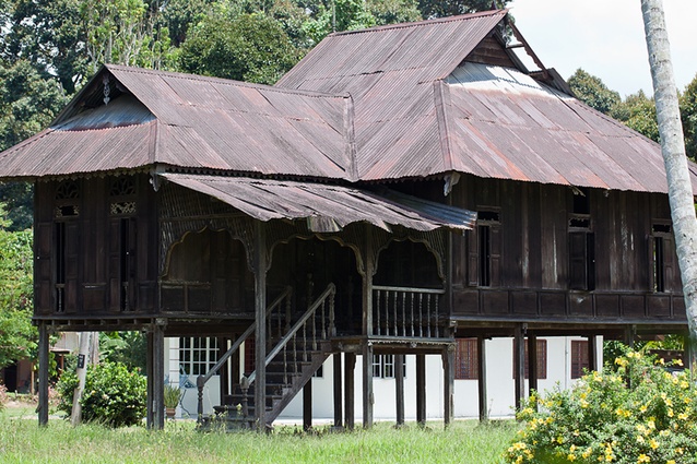 The vernacular Malay home responds well to the hot, humid climate with gabled roofs for good ventilation. Often built of timber, these stilted homes also feature exterior decoration, a staircase and partitioned rooms.