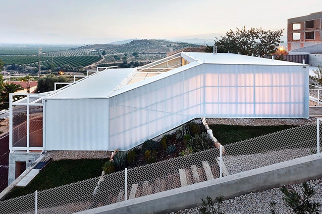 Seasonless House by Casos de Casas. Built in Spain in 2013. The home's double walls made from cellular polycarbonate means that the house feels open and closed at the same time.