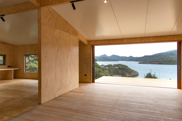 The use of plywood creates a warm and welcoming interior.