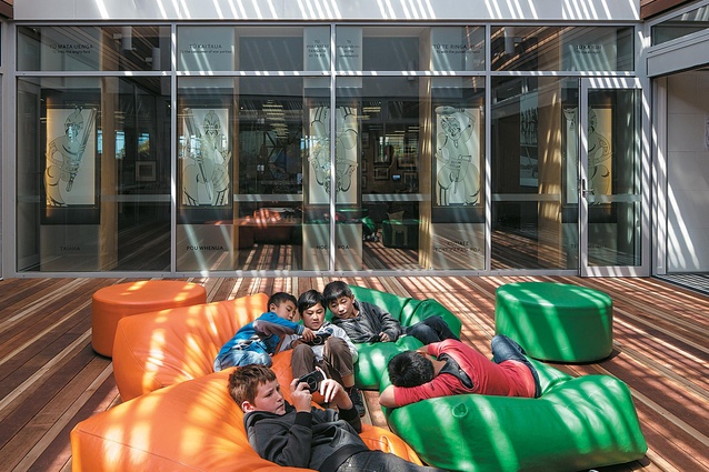 An internal atrium courtyard draws natural light in between the library and exhibition spaces, and provides ample relaxation space for these young visitors.