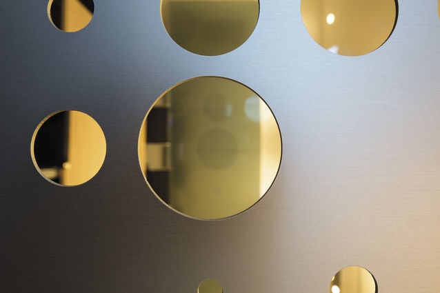 View through the perforated screens that separate areas of the fit-out, such as meeting rooms.