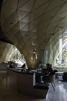 The cave-like structure in the cafe references the natural arch of Cathedral Cove in the Coromandel.