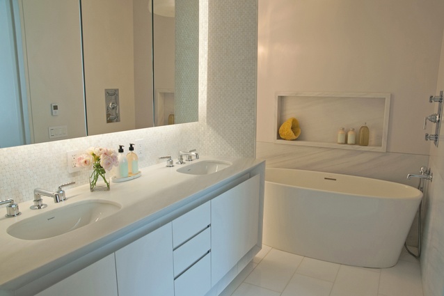 Reflective surfaces emphasise the light sources, which is especially important in the bathroom, which has no windows. 
