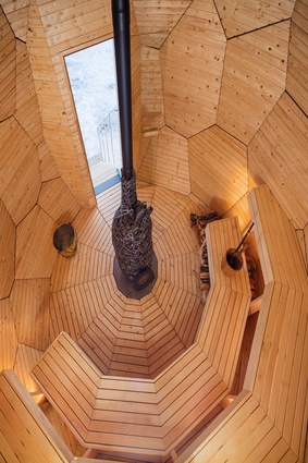 The interior of the Solar Egg is made of pine and aspen and has a central oven made from local iron and stones. 