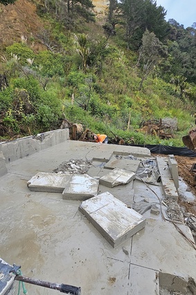Deconstruction crews cut slabs into pieces but handling requires heavy equipment, making containment difficult, particularly in the latter stages of the process.