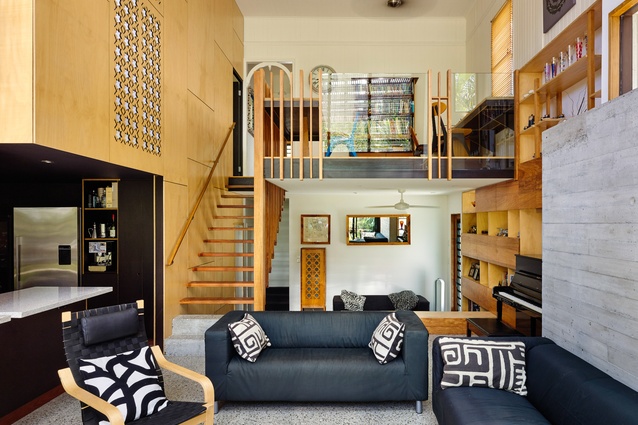 The renovation put living spaces on the ground floor and inserted a mezzanine with a study.
